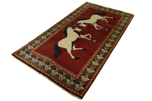 Corner detail of 2000s Persian Gabbeh rug showing border pattern and Wool pile
