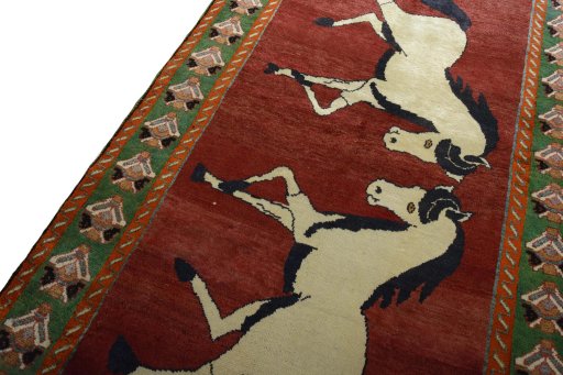 Backside of handmade 2000s Persian Gabbeh rug showing knot structure and weave density