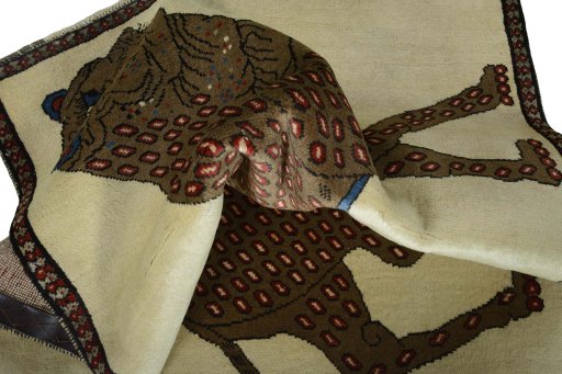 Corner detail of 2000s Persian Gabbeh rug showing border pattern and Wool pile
