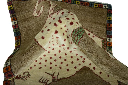 Corner detail of 2000s Persian Gabbeh rug showing border pattern and Wool pile