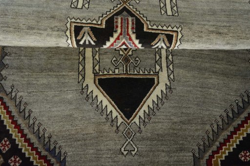 Corner detail of 2000s Persian Gabbeh rug showing border pattern and Wool pile