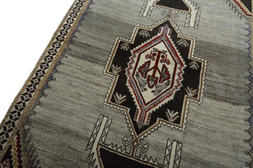 Backside of handmade 2000s Persian Gabbeh rug showing knot structure and weave density