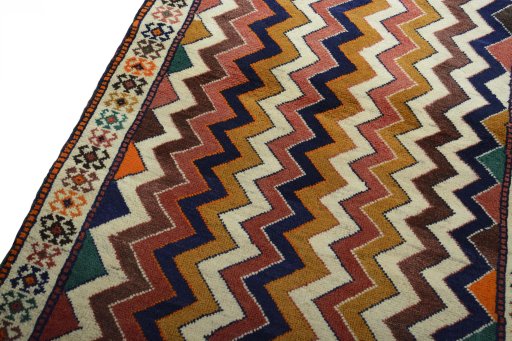 Backside of handmade 2000s Persian Gabbeh rug showing knot structure and weave density