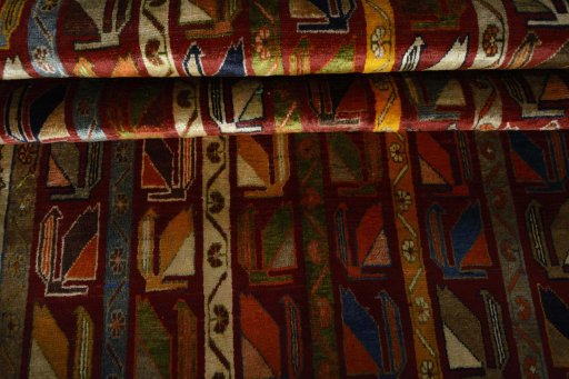 Corner detail of 2000s Persian Gabbeh rug showing border pattern and Wool pile