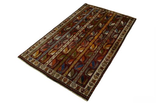 Corner detail of 2000s Persian Gabbeh rug showing border pattern and Wool pile