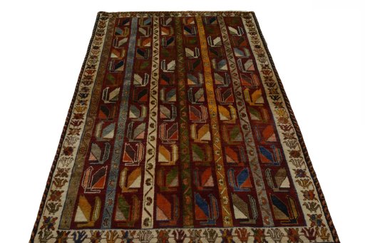 Surface texture of 2000s Persian Gabbeh rug with natural Wool and intricate pattern