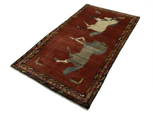 Corner detail of 2000s Persian Gabbeh rug showing border pattern and Wool pile