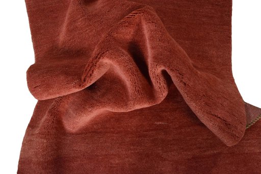 Corner detail of New Persian Gabbeh rug showing border pattern and Wool pile