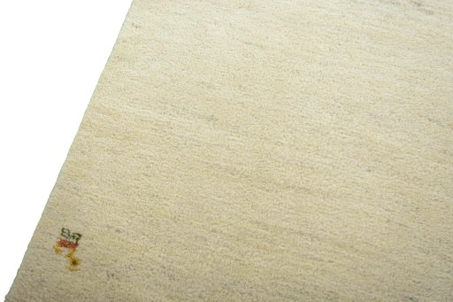 Backside of handmade New Persian Gabbeh rug showing knot structure and weave density