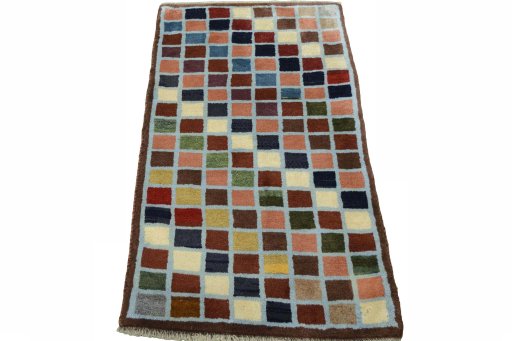 Surface texture of 2000s Persian Gabbeh rug with natural Wool and intricate pattern