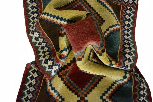 Corner detail of 2000s Persian Gabbeh rug showing border pattern and Wool pile