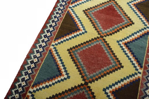 Backside of handmade 2000s Persian Gabbeh rug showing knot structure and weave density