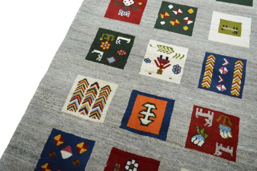 Backside of handmade New Persian Gabbeh rug showing knot structure and weave density