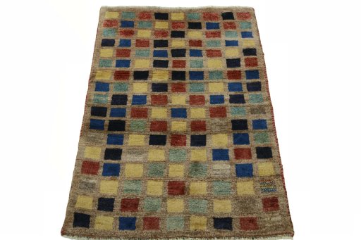Surface texture of 2000s Persian Gabbeh rug with natural Wool and intricate pattern
