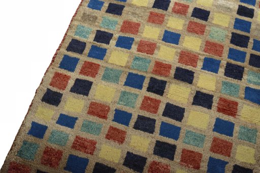 Backside of handmade 2000s Persian Gabbeh rug showing knot structure and weave density