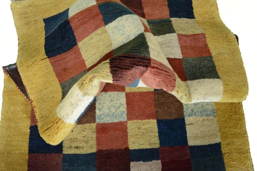 Corner detail of New Persian Gabbeh rug showing border pattern and Wool pile