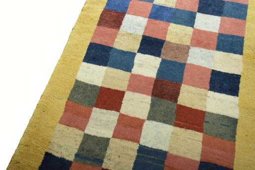 Backside of handmade New Persian Gabbeh rug showing knot structure and weave density