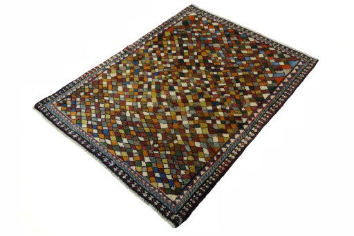 Corner detail of 2000s Persian Gabbeh rug showing border pattern and Wool pile