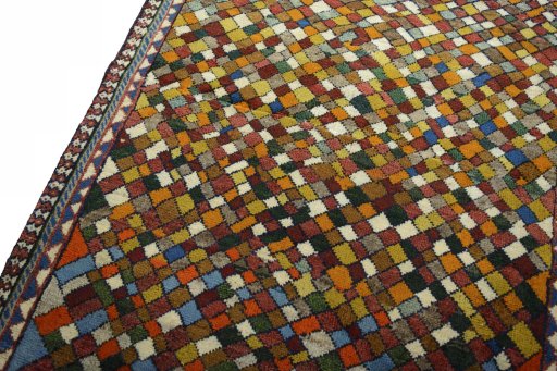 Backside of handmade 2000s Persian Gabbeh rug showing knot structure and weave density