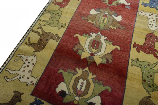 Backside of handmade 2000s Persian Gabbeh rug showing knot structure and weave density