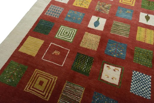 Backside of handmade New Persian Gabbeh rug showing knot structure and weave density