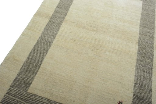 Backside of handmade New Persian Gabbeh rug showing knot structure and weave density