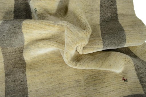 Corner detail of New Persian Gabbeh rug showing border pattern and Wool pile
