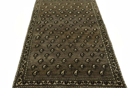Surface texture of 2000s Persian Gabbeh rug with natural Wool and intricate pattern