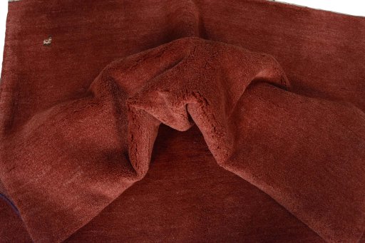 Corner detail of New Persian Gabbeh rug showing border pattern and Wool pile