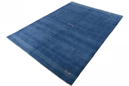 Corner detail of New Persian Gabbeh rug showing border pattern and Wool pile