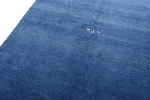 Backside of handmade New Persian Gabbeh rug showing knot structure and weave density