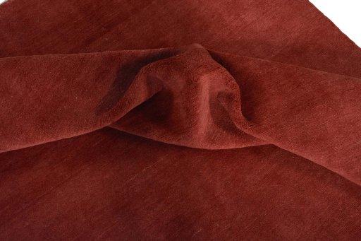 Corner detail of New Persian Gabbeh rug showing border pattern and Wool pile