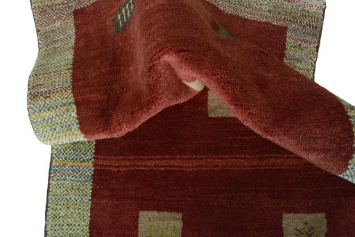 Corner detail of New Persian Gabbeh rug showing border pattern and Wool pile