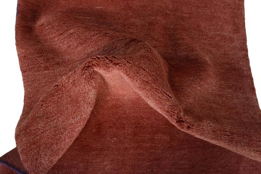 Corner detail of New Persian Gabbeh rug showing border pattern and Wool pile