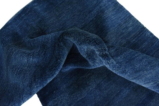 Corner detail of New Persian Gabbeh rug showing border pattern and Wool pile
