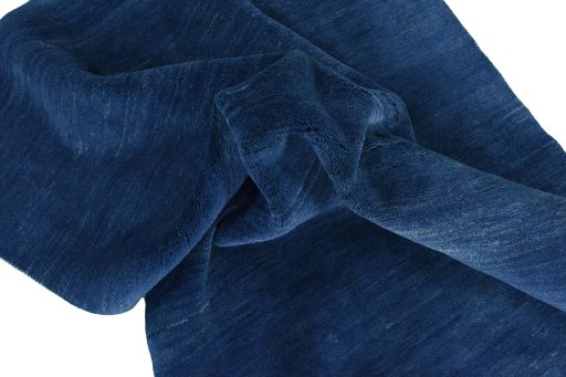 Corner detail of New Persian Gabbeh rug showing border pattern and Wool pile