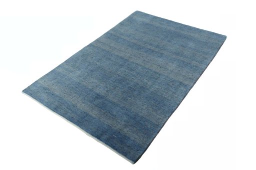 Corner detail of New Persian Gabbeh rug showing border pattern and Wool pile