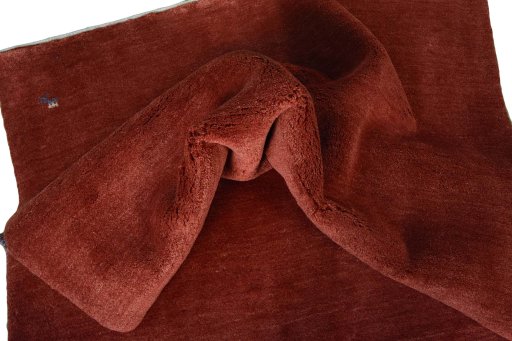 Corner detail of New Persian Gabbeh rug showing border pattern and Wool pile