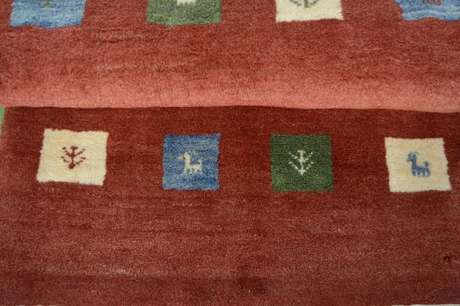 Full view of New Persian Gabbeh rug from Iran / Persia, 128 × 83 cm in Red tones