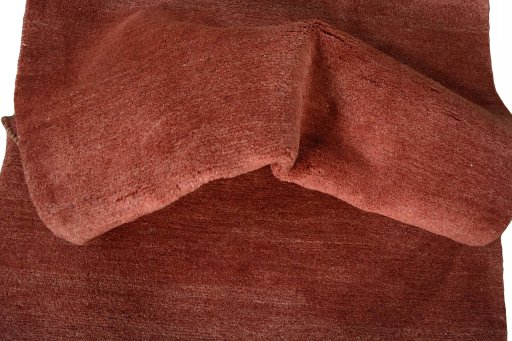 Corner detail of New Persian Gabbeh rug showing border pattern and Wool pile