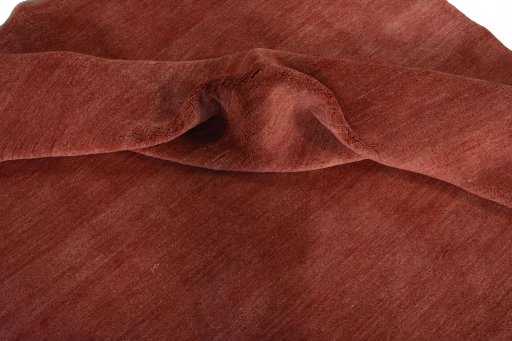 Corner detail of New Persian Gabbeh rug showing border pattern and Wool pile