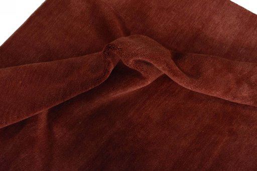 Corner detail of New Persian Gabbeh rug showing border pattern and Wool pile