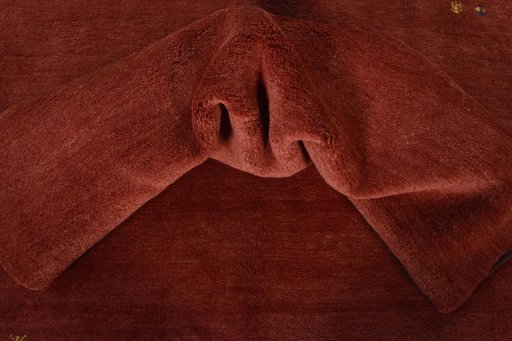 Corner detail of New Persian Gabbeh rug showing border pattern and Wool pile