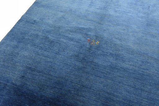 Backside of handmade New Persian Gabbeh rug showing knot structure and weave density