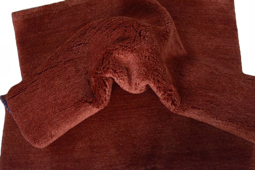Corner detail of New Persian Gabbeh rug showing border pattern and Wool pile