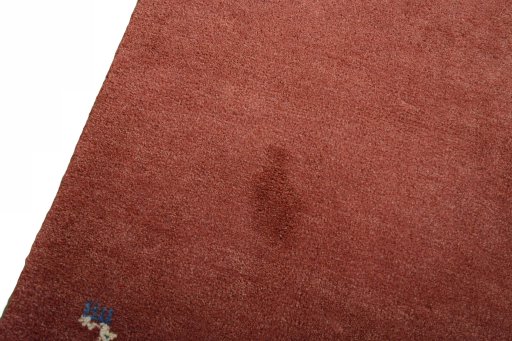 Backside of handmade New Persian Gabbeh rug showing knot structure and weave density