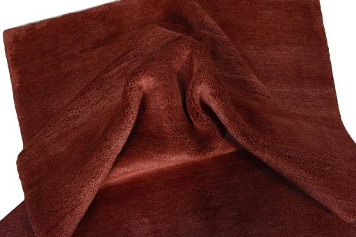 Corner detail of New Persian Gabbeh rug showing border pattern and Wool pile