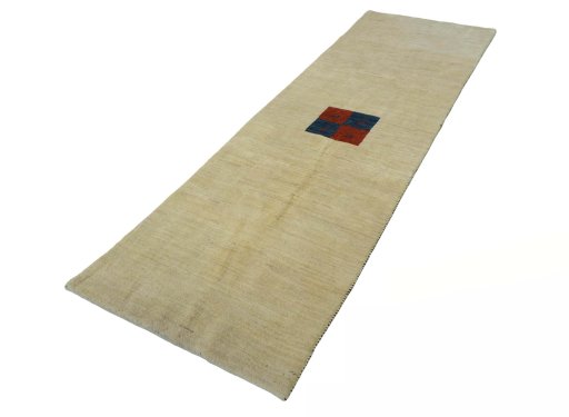 Corner detail of New Persian Gabbeh rug showing border pattern and Wool pile