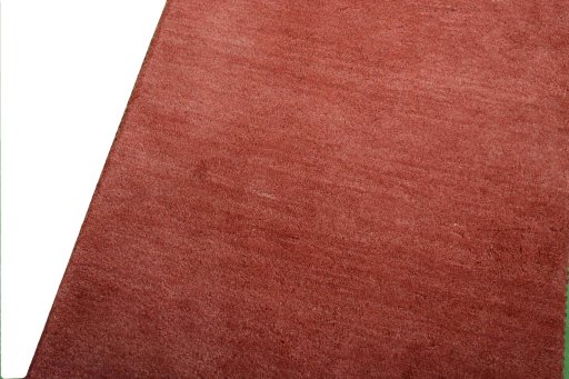 Backside of handmade New Persian Gabbeh rug showing knot structure and weave density