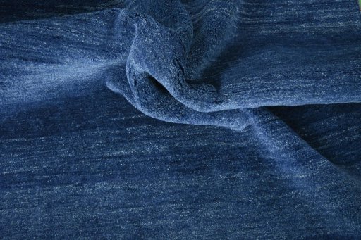 Corner detail of New Persian Gabbeh rug showing border pattern and Wool pile